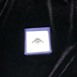 Cubic zirconia solitaire set in sterling silver.